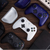 Collection of gaming controllers and accessories on a wooden surface