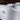 Thumbnail for Close-up of a white Ultimate 2 Wireless controller with a control knob on a dark background