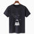 Black t-shirt with an astronaut sitting on a bench in space, with the moon and stars on outlines in the backdrop, set against a white background