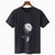Black t-shirt with white graphic of a moon and astronaut on a swing against a white background