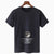 Black t-shirt with moon and star over a body of water design on a hanger against a white background