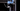 Thumbnail for Close-up of a 3D printer's mechanical components on a black background