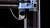 Close-up of a 3D printer's mechanical components on a black background