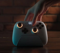 Video clip showing the 8BitDo Ultimate Wireless 2 being placed on its charging dock against a dark background