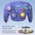 Purple gaming controller with NFC function on a light blue background, featuring amiibo characters below.