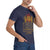 Person wearing a navy blue t-shirt with a graphic design and text.