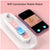 Vacuum blackhead remover with pink and white design showing connection to mobile phone.
