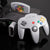 Nintendo 64 console with wireless controller and 'Super Mario' cartridge on a reflective surface.
