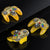 Three transparent yellow gaming controllers on a black surface