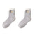 Fluffy Top Thick Tube Socks: Cute socks with an embroidered badge, ideal for colder days