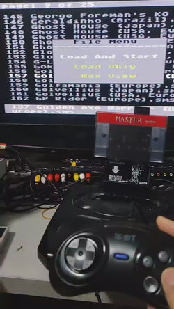An adapter to convert SEGA Mark III, SG-1000 and SC-3000 cartridges to SEGA Master System consoles. Shown in use on a Master system console.